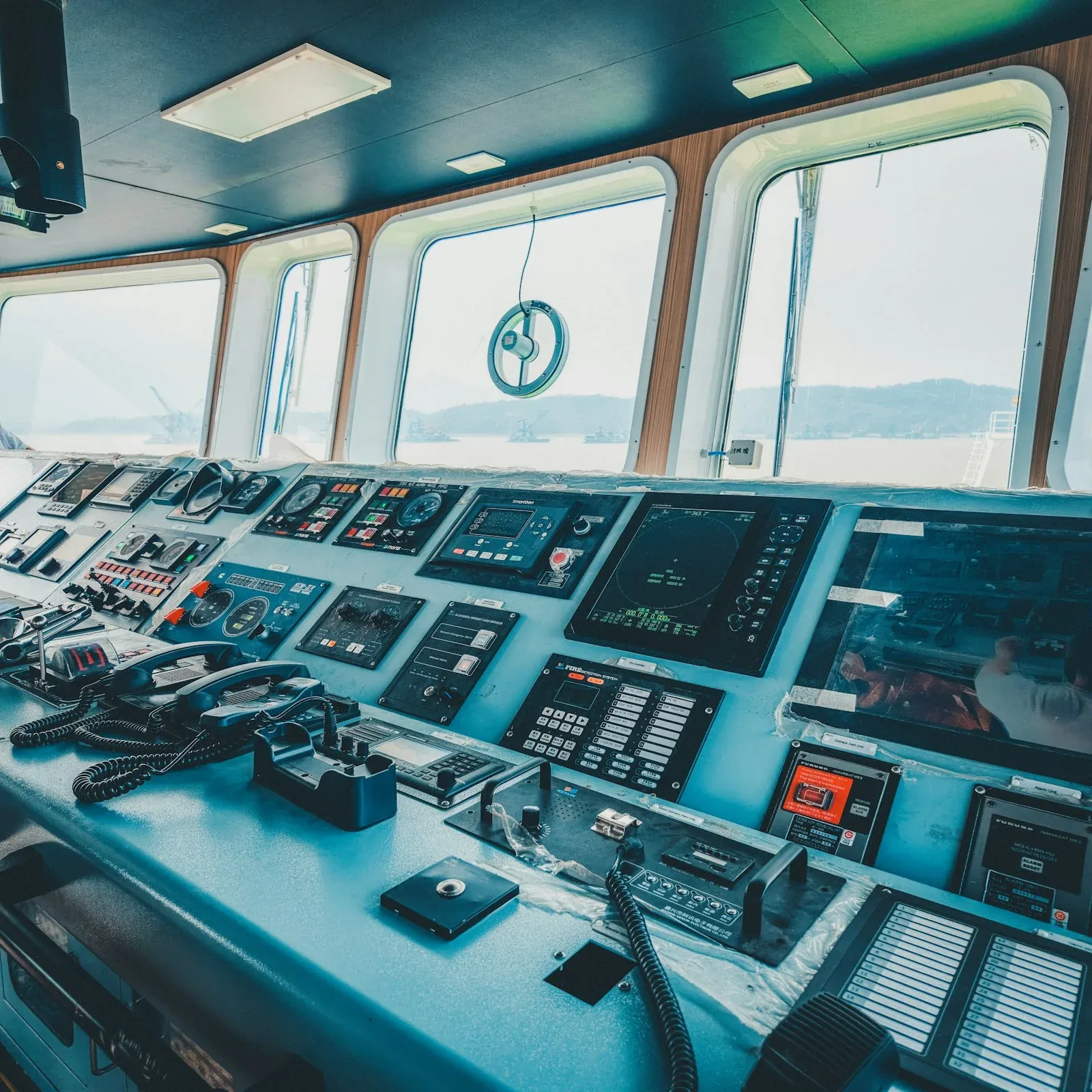 Ship's bridge console with navigation screens